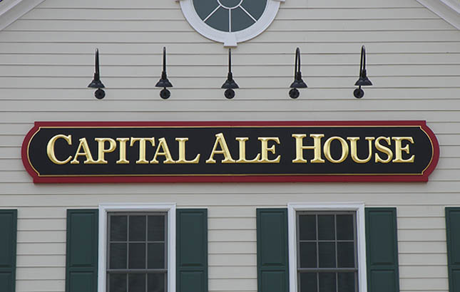 CAPITAL ALE HOUSE - MIDLOTHIAN, VA 2’-6” X 16’ FABRICATED ALUMINUM STORE FRONT SIGN WITH INDIVIDUAL HDU APPLIED PRISMATIC GOLD-LEAFED COPY FOR COLONIAL THEME SHOPPING CENTER