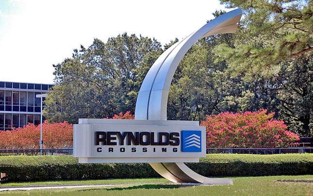 REYNOLDS CROSSING HENRICO, VA 25’ TALL BRUSHED ALUMINUM SCULPTURAL MONUMENT ENTRY SIGN WITH 5’ X 16’ INTERNALLY ILLUMINATED SIGN FACE WITH HALO LIT COPY AND LOGO.