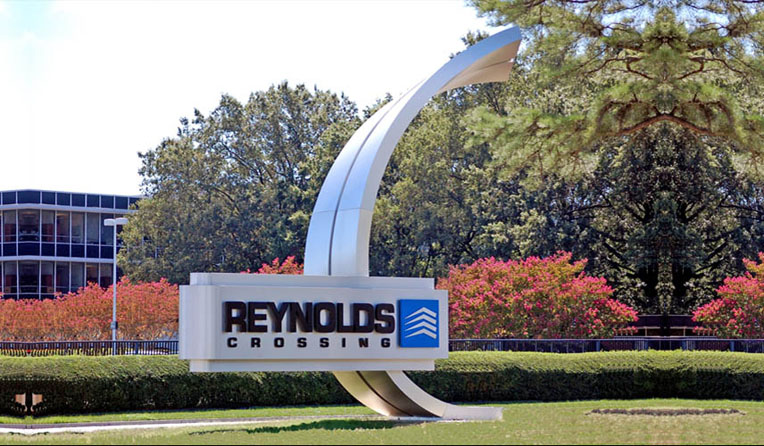REYNOLDS CROSSING HENRICO, VA 25’ TALL BRUSHED ALUMINUM SCULPTURAL MONUMENT ENTRY SIGN WITH 5’ X 16’ INTERNALLY ILLUMINATED SIGN FACE WITH HALO LIT COPY AND LOGO.