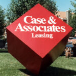 cube shape entrance sign-mounted on corner Case & Associates Leasing
